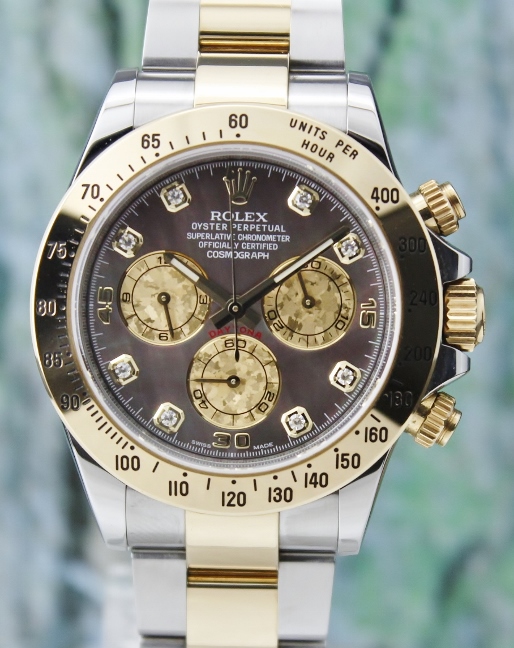 A ROLEX OYSTER 18K YELLOW GOLD AND STAINLESS STEEL DAYTONA COSMOGRAPH - 116523